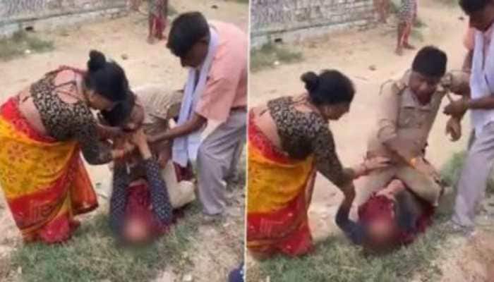 UP Police officer caught on cam &#039;sitting on woman&#039;, Kanpur cops issue clarification