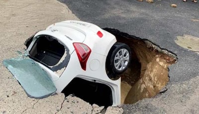 Car submerges in sinkhole as portion of road caves in after rains in Delhi