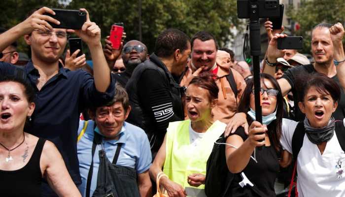 Australians may face longer lockdown after mass protest as COVID cases rise