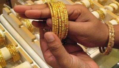 Gold tumbles to reach Rs 46,917; silver marginally lower
