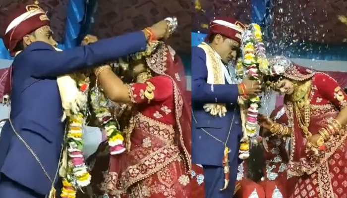 Viral video: Dulha-Dulhan trapped in varmala? Watch what happens next