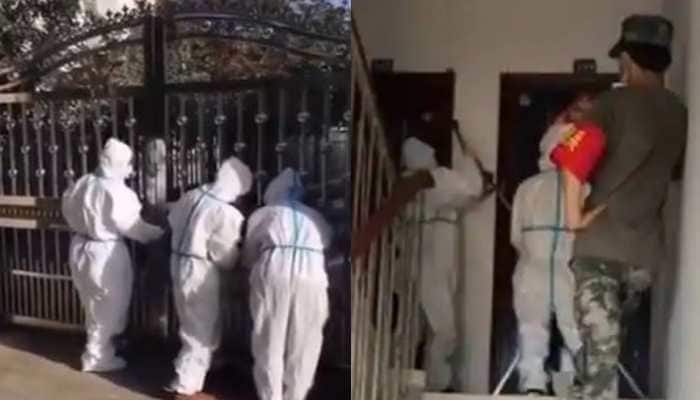 Videos show Chinese officials locking people inside their houses as Delta variant cases surge- Watch