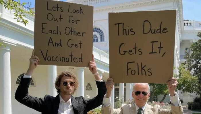 US Prez Biden and &#039;dude with sign&#039; hold placards to promote COVID vaccination, pic goes viral