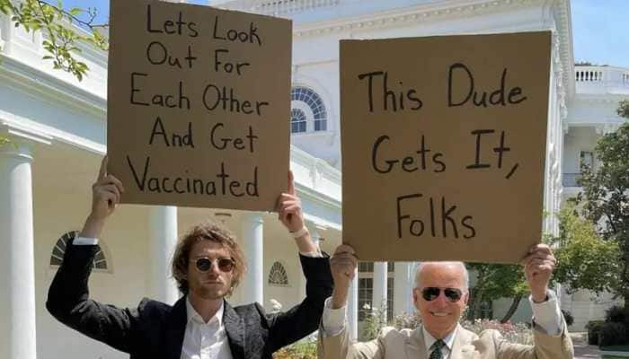 US Prez Biden and &#039;dude with sign&#039; hold placards to promote COVID vaccination, pic goes viral