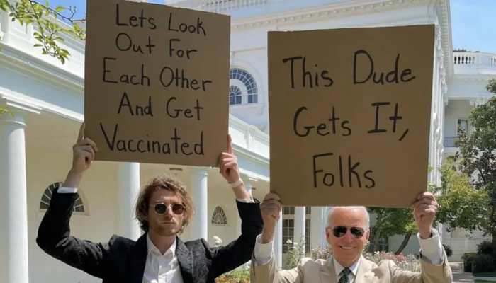US Prez Biden and 'dude with sign' hold placards to promote COVID vaccination, pic goes viral