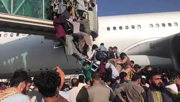 Afghanistan crisis: Chaos, panic as thousands gather at Kabul airport to flee country, US troops fire shots to disperse crowd | World News | Zee News