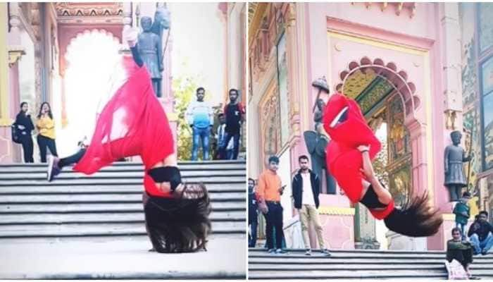 Girl&#039;s jaw-dropping backflips in red saree leave netizens amazed -- Watch