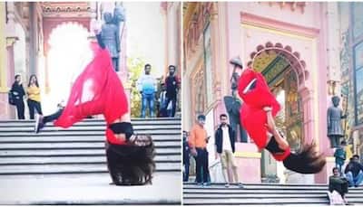 Girl's jaw-dropping backflips in red saree leave netizens amazed -- Watch