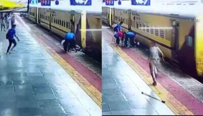 Caught on camera: Indore woman falls under moving train, saved by alertness of co-passengers- Watch