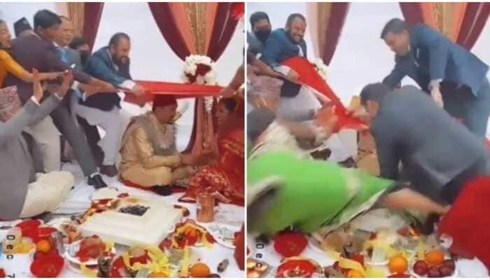 Tug of war at wedding mandap? Narrow escape for baraatis as bride and groom look shocked - Watch