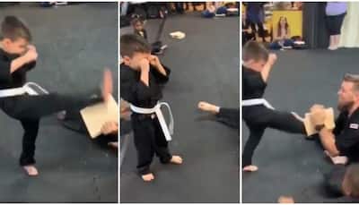 Need some positivity? Watch this 'karate kid' not give up on his task with 'help' from instructor