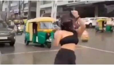 Indore girl dances on traffic light, amused passerby watch her