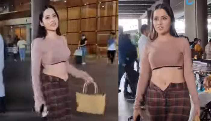 Bigg Boss OTT fame Urfi Javed BRUTALLY trolled for wearing unbuttoned chequered pants to airport, gets papped - Watch