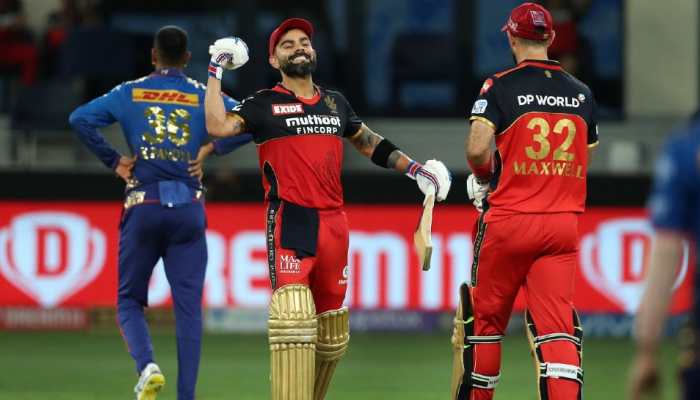 Royal Challengers Bangalore skipper Virat Kohli celebrates after completing a fifty against Mumbai Indians in their IPL 2021 match in Dubai. (Photo: PTI)