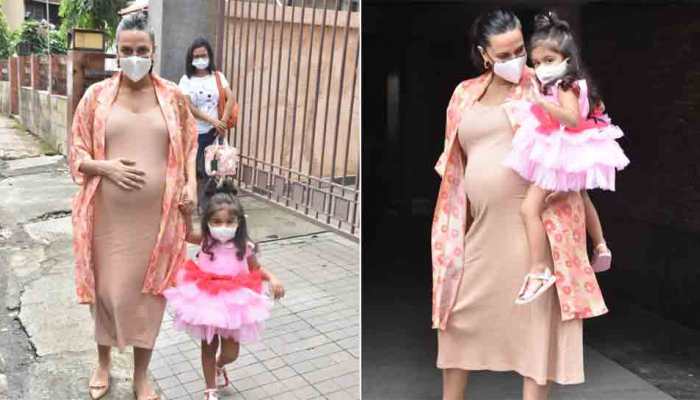 Heavily pregnant Neha Dhupia flaunts baby bump as she attends birthday party with daughter, see photos