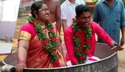 Kerala couple wades through floodwater in improvised vessel to get married, watch video
