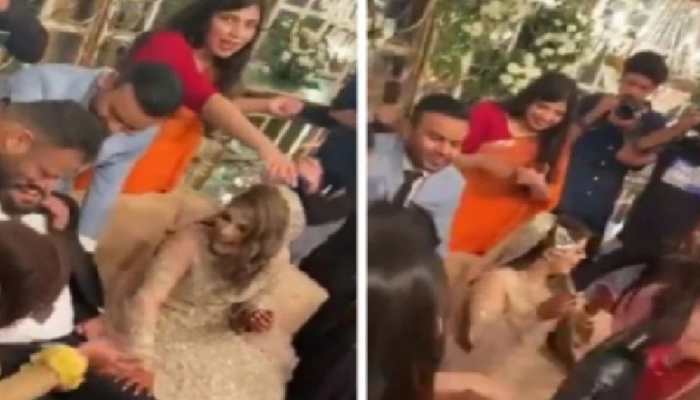 Sisters-in-law play THIS prank of  groom as bride looks amused, soon he&#039;s left with no shoes - Watch