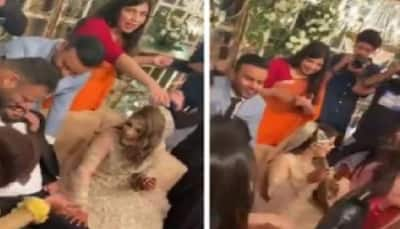 Sisters-in-law play THIS prank of  groom as bride looks amused, soon he's left with no shoes - Watch