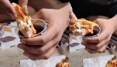 Boy dips pizza slice in Coca-cola and eats it, netizens ask ‘kaun hai yeh log’ 