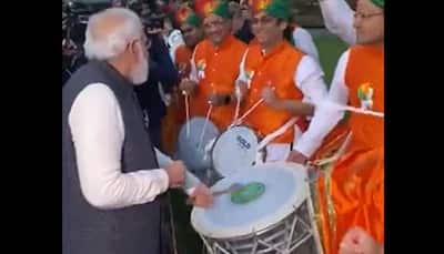 PM Narendra Modi plays drums during his interaction with Indians in Scotland - WATCH