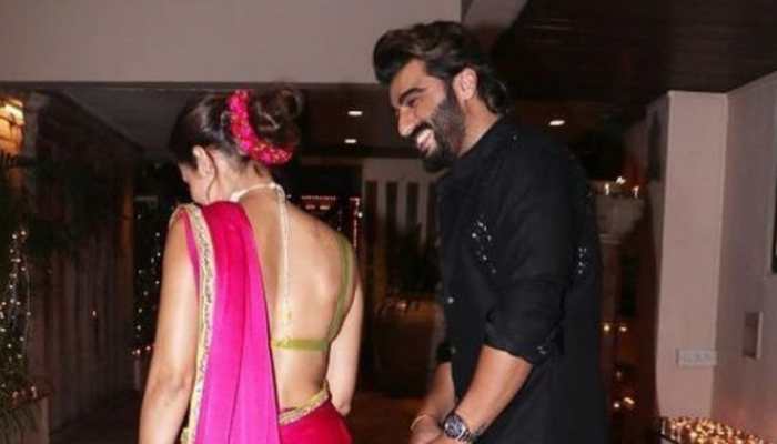 Arjun Kapoor&#039;s romantic glance at Malaika Arora from their unseen Diwali pic is everything!