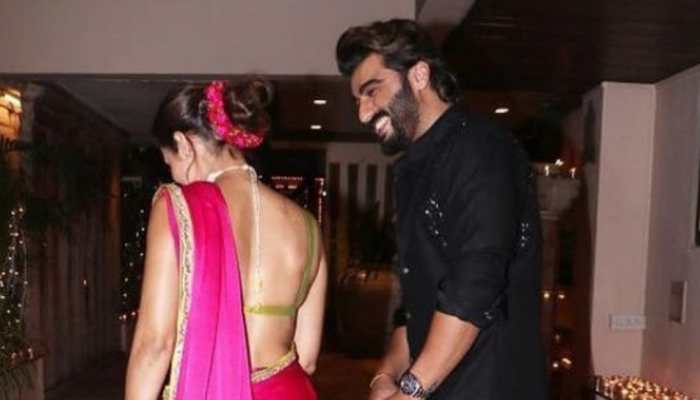 Arjun Kapoor's romantic glance at Malaika Arora from their unseen Diwali pic is everything!