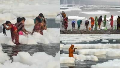 Chhath devotees take dip in toxic foam floating on Yamuna river- Watch