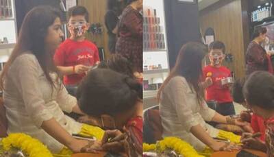 Child feeds his mom as she gets her mehendi done - watch adorable video here