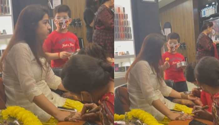 Child feeds his mom as she gets her mehendi done - watch adorable video here