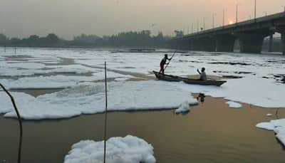 Delhi govt deploys 15 boats to remove froth from Yamuna with ropes 