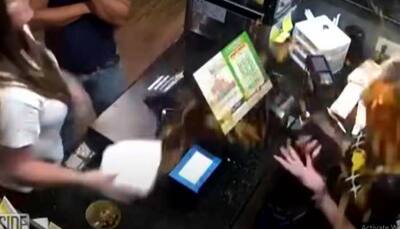 Angry customer throws soup at restaurant manager's face - watch shocking video