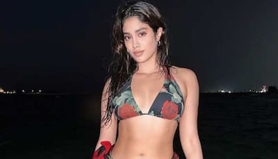 Janhvi Kapoor raises the heat in black floral bikini, does 'lungi dance' on beach - In Pics