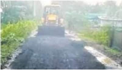 Bridegroom's family lays blacktop road just day before marriage for guests' convenience 