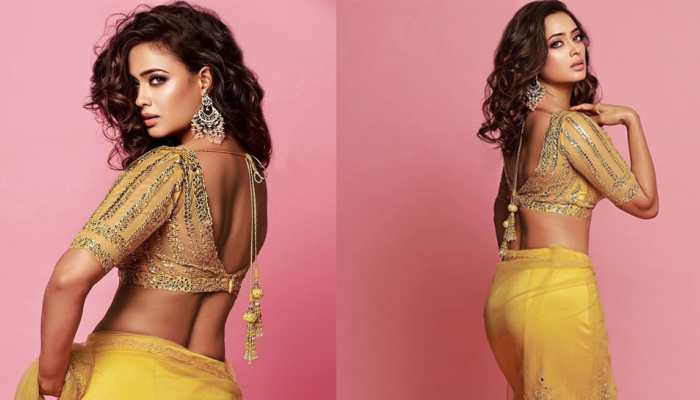 Shweta Tiwari flaunts her toned midriff in a glam yellow saree, photoshoot goes viral!