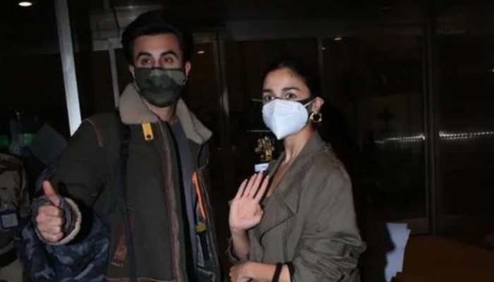 Alia Bhatt and beau Ranbir Kapoor twin in hues of brown as they leave for New Year&#039;s vacay!