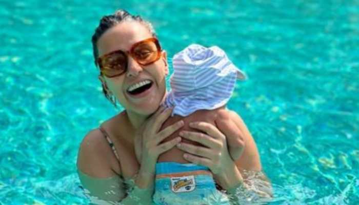 Angad Bedi, Neha Dhupia REVEAL their son&#039;s unique name, share family pool pic!