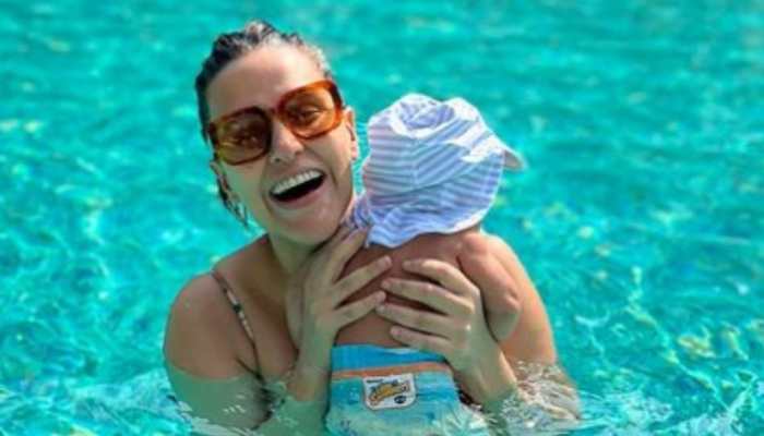 Angad Bedi, Neha Dhupia REVEAL their son's unique name, share family pool pic!