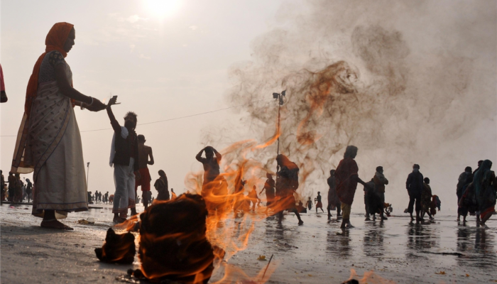 Devotees offer prayers at Gangasagar on Makar Sankranti.