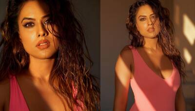 Nia Sharma shares sultry sun-kissed photo in a pink monokini, Nisha Rawal asks, ‘How so hot’