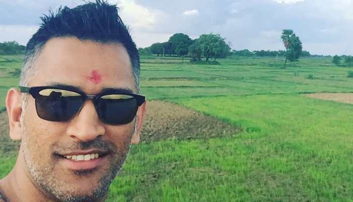 MS Dhoni enjoying a walk through mustard crop at his Ranchi farmhouse - SEE PICS 