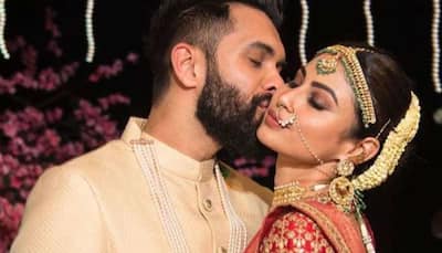 Mouni Roy kissing Suraj Nambiar viral video: Newlyweds share a passionate liplock as they cut cake - Watch