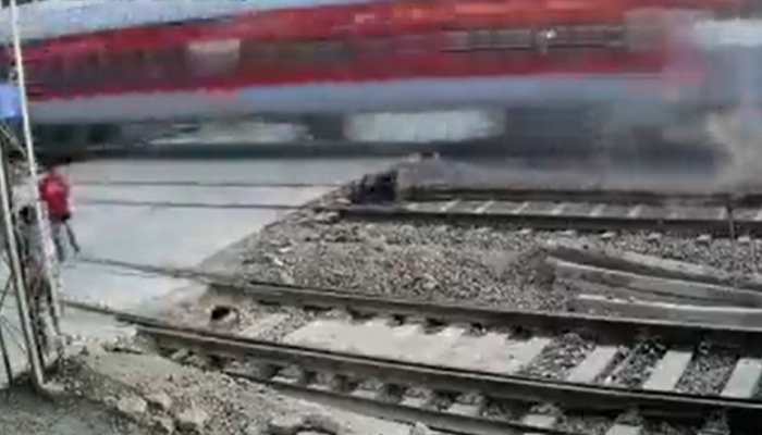 WATCH: Biker has a narrow escape from speeding Rajdhani Express in Mumbai, video goes viral