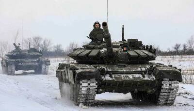 Russia shows signs of easing Ukraine tensions, posts video showing tanks leaving Crimea