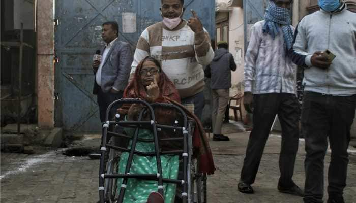 Voters arrive to cast their votes for UP Assembly Polls in Karhal.