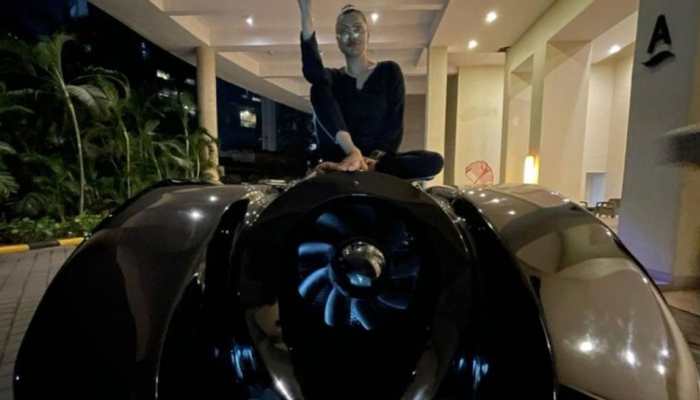 Ahmed Khan and his wife arrive in their desi swanky batmobile car at 'The Batman' movie screening - Watch