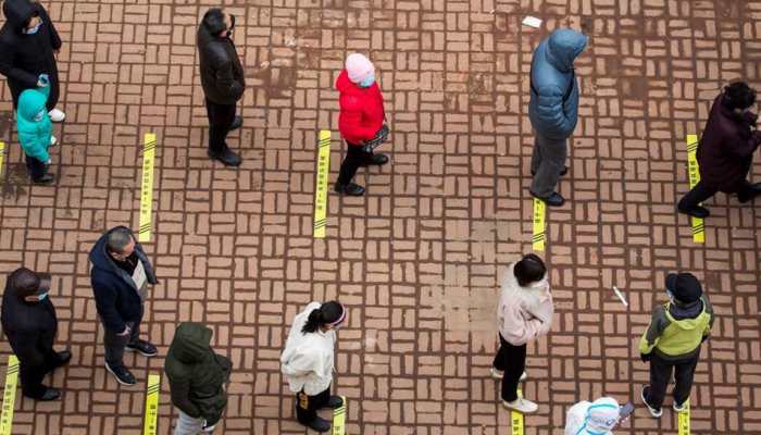 Travel bans and lockdowns in China as Covid-19 surges, 2,591 new local cases reported 