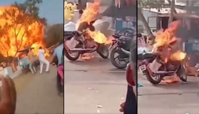 Watch: Royal Enfield bike abruptly catches fire outside a temple in Andhra Pradesh