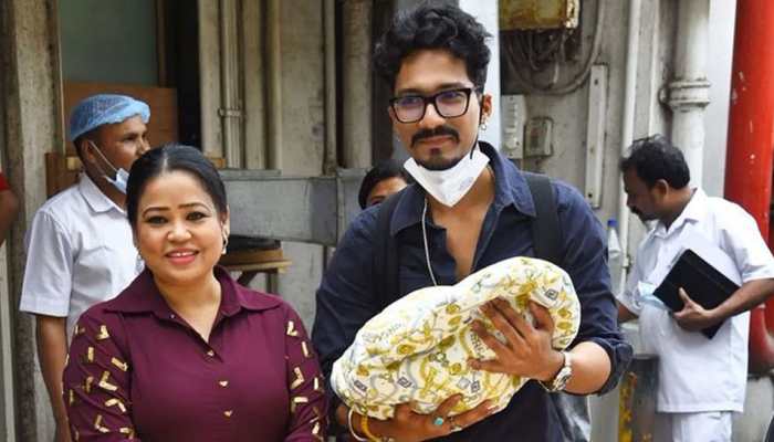 Bharti Singh, Haarsh Limbachiyaa cradle newborn baby boy, pose for paps outside hospital- Watch