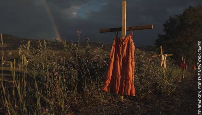 Haunting pic of dresses hung in crosses at kids&#039; burial site near Canada school awarded