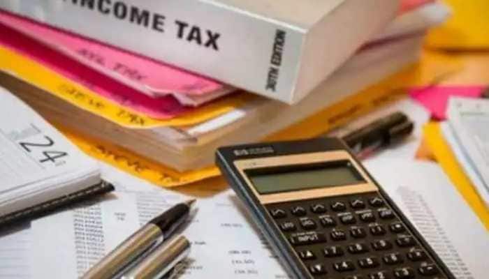 india's tax collections soar to record rs 27.07 lakh crore in fy22 | economy news | zee news